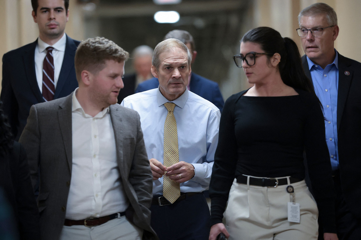 Jim Jordan (wearing a tie) is Scalise's top party rival for Speaker of the House.  Image from Getty Images via AFP